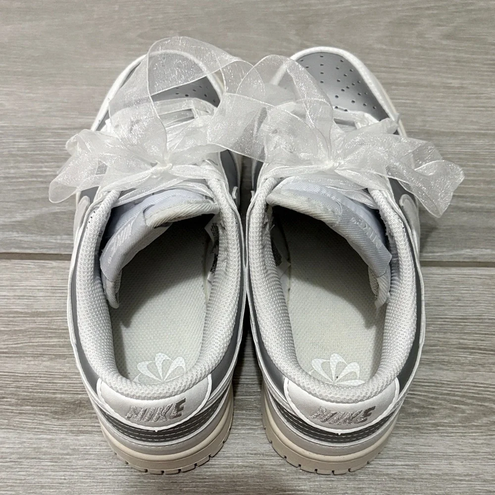 Nike Low-Top Sneakers in White and Metallic Silver